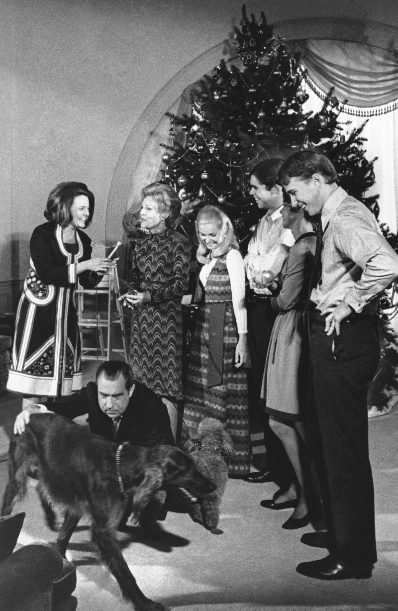 Illustration for article titled 70 Years of First Ladies Standing in Front of Christmas TreesÂ